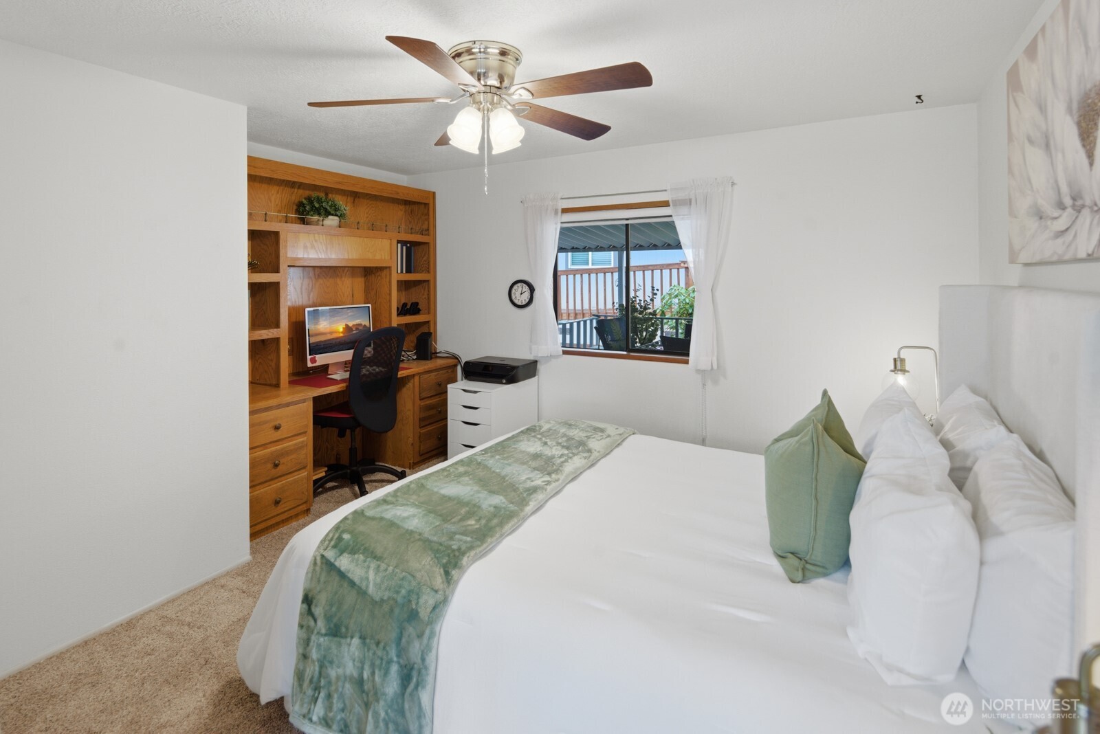 First guest bedroom with built-in desk and hutch