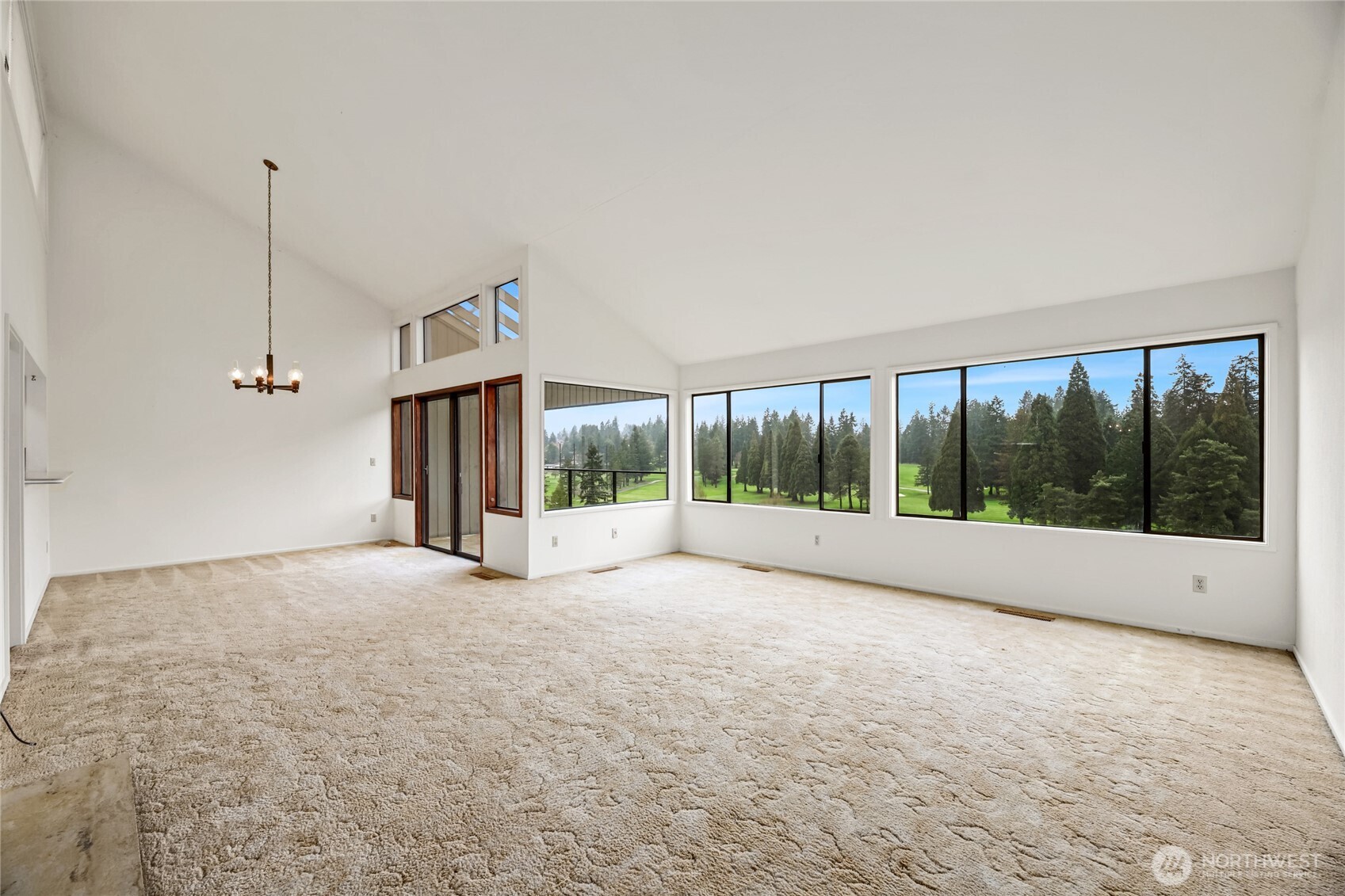 GREAT ROOM  Covered deck and wall of windows overlooks AMAZING golf course   views of holes #7, 8 & 9