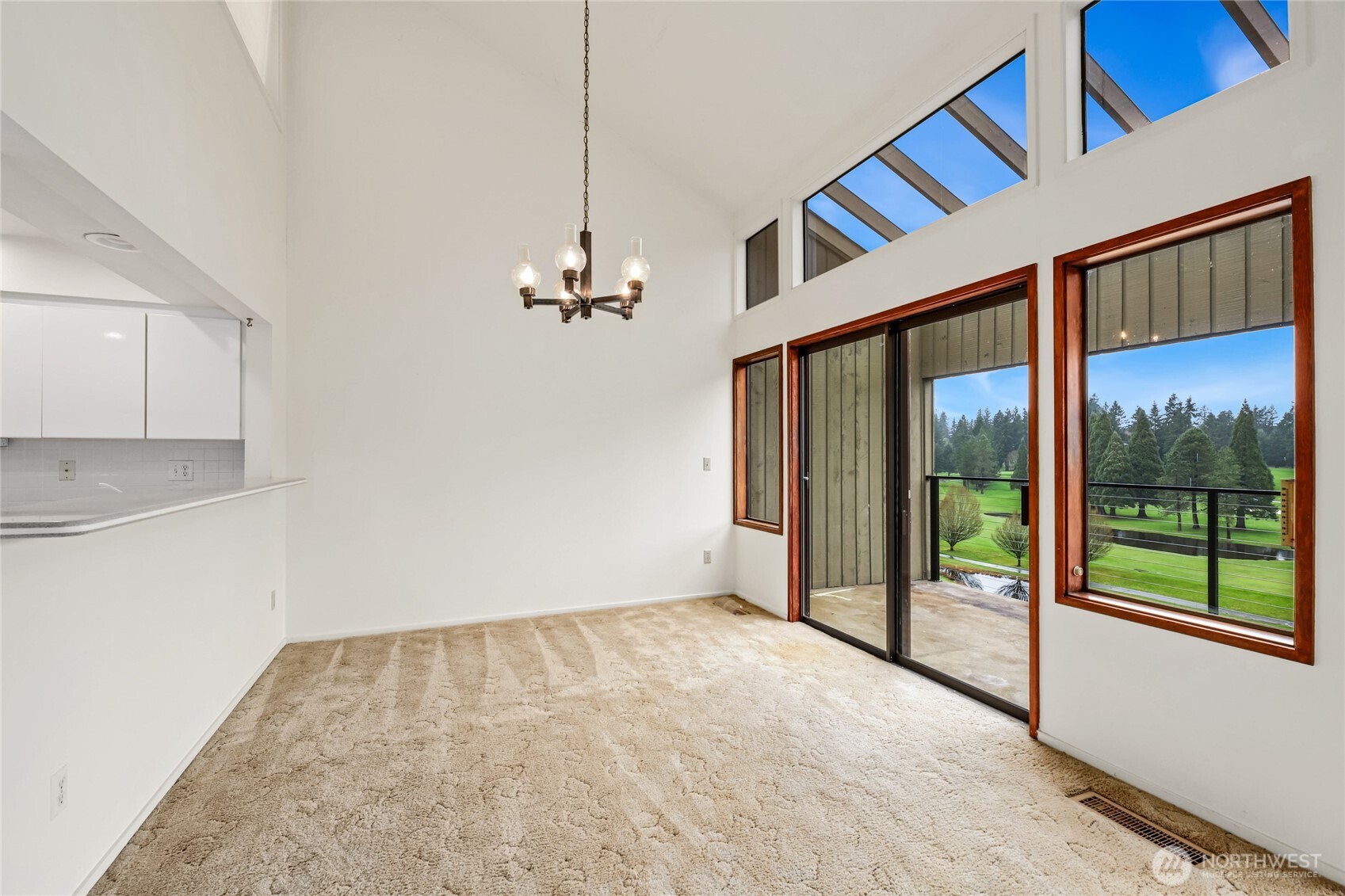 Dining area with slider to covered patio  Recessed lighting