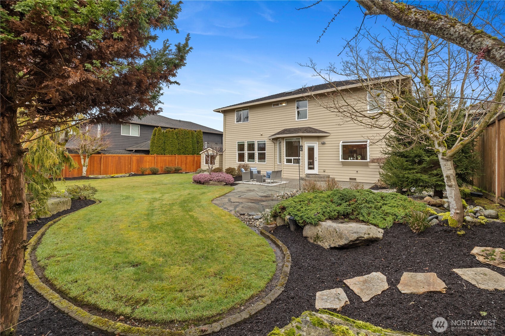 A backyard oasis designed for both peaceful solitude and lively gatherings.