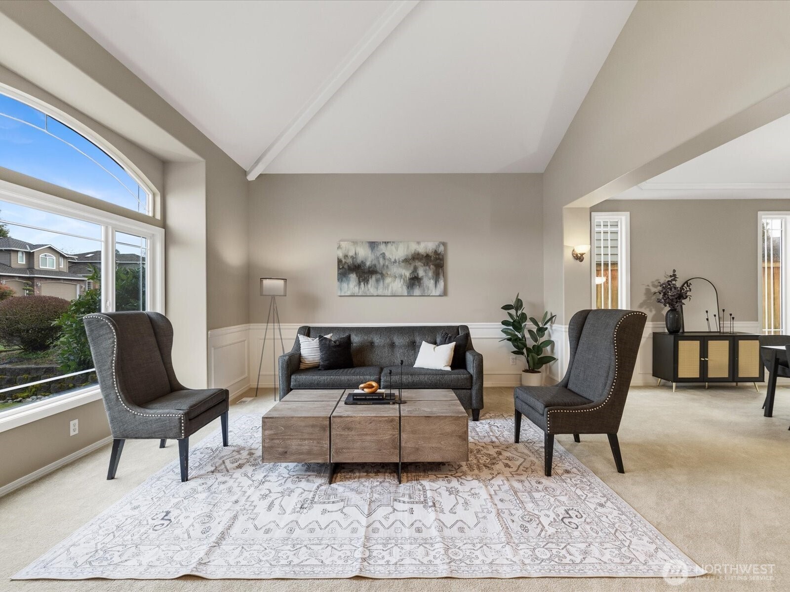 Architectural drama meets livable luxury in this stunning foyer.