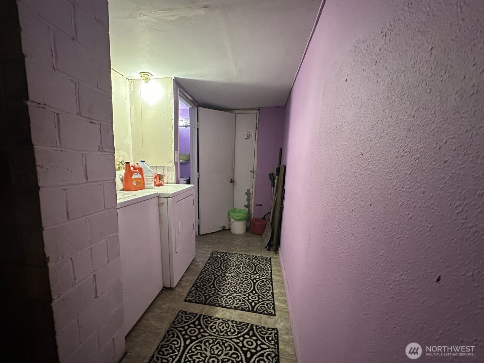 At the end of hall is exterior exit to back yard.  Bathroom to left at end of hall.