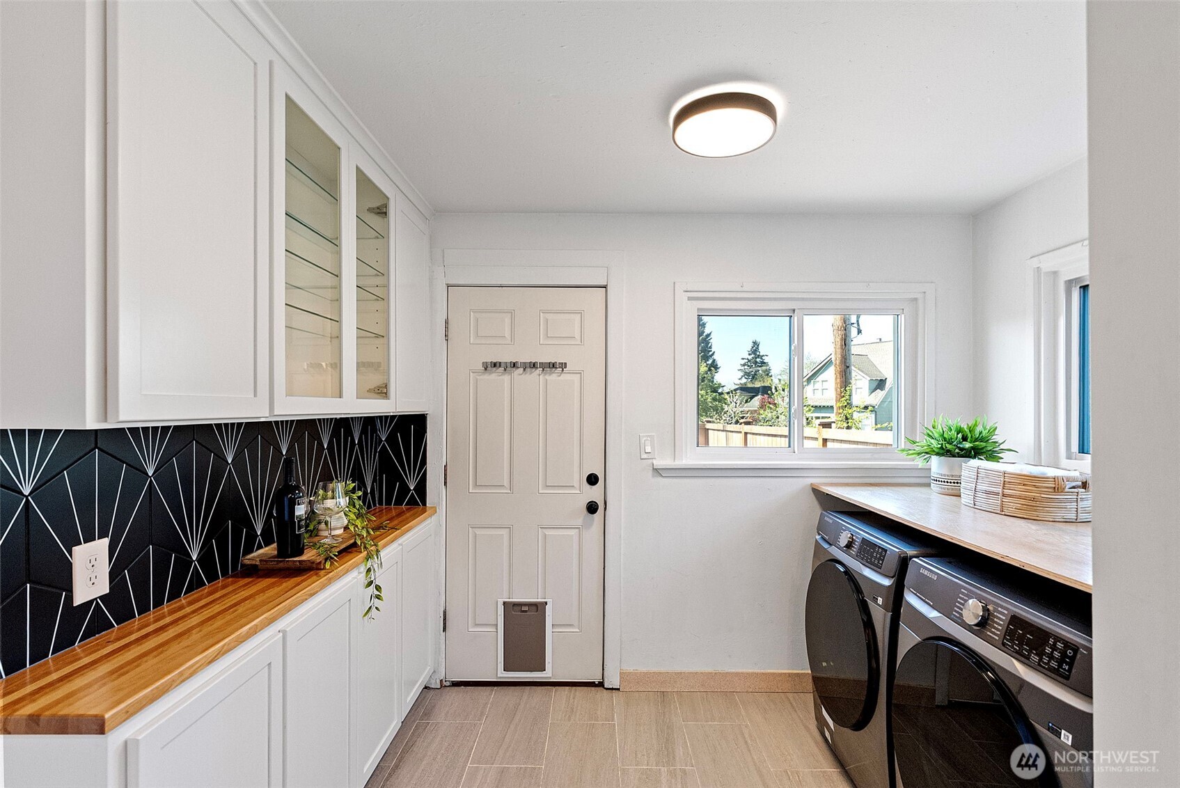 Additional cabinet space with a brand new washer and dryer conveniently located off the kitchen.