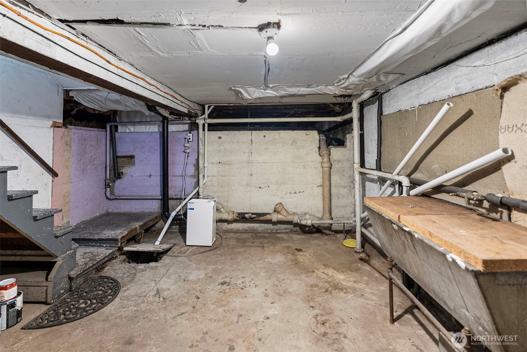 Unfinished basement provides an abundance of additional storage space.