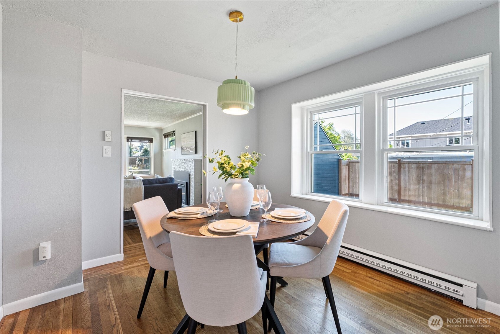 Bright dining room between the living room and the kitchen.