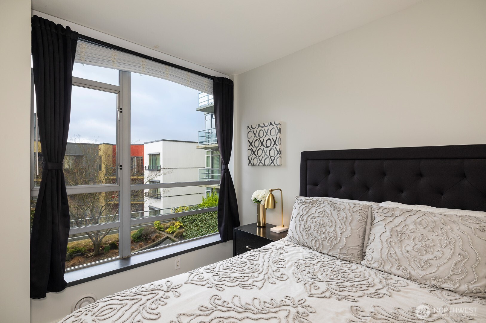 Bedroom has view of patio area.