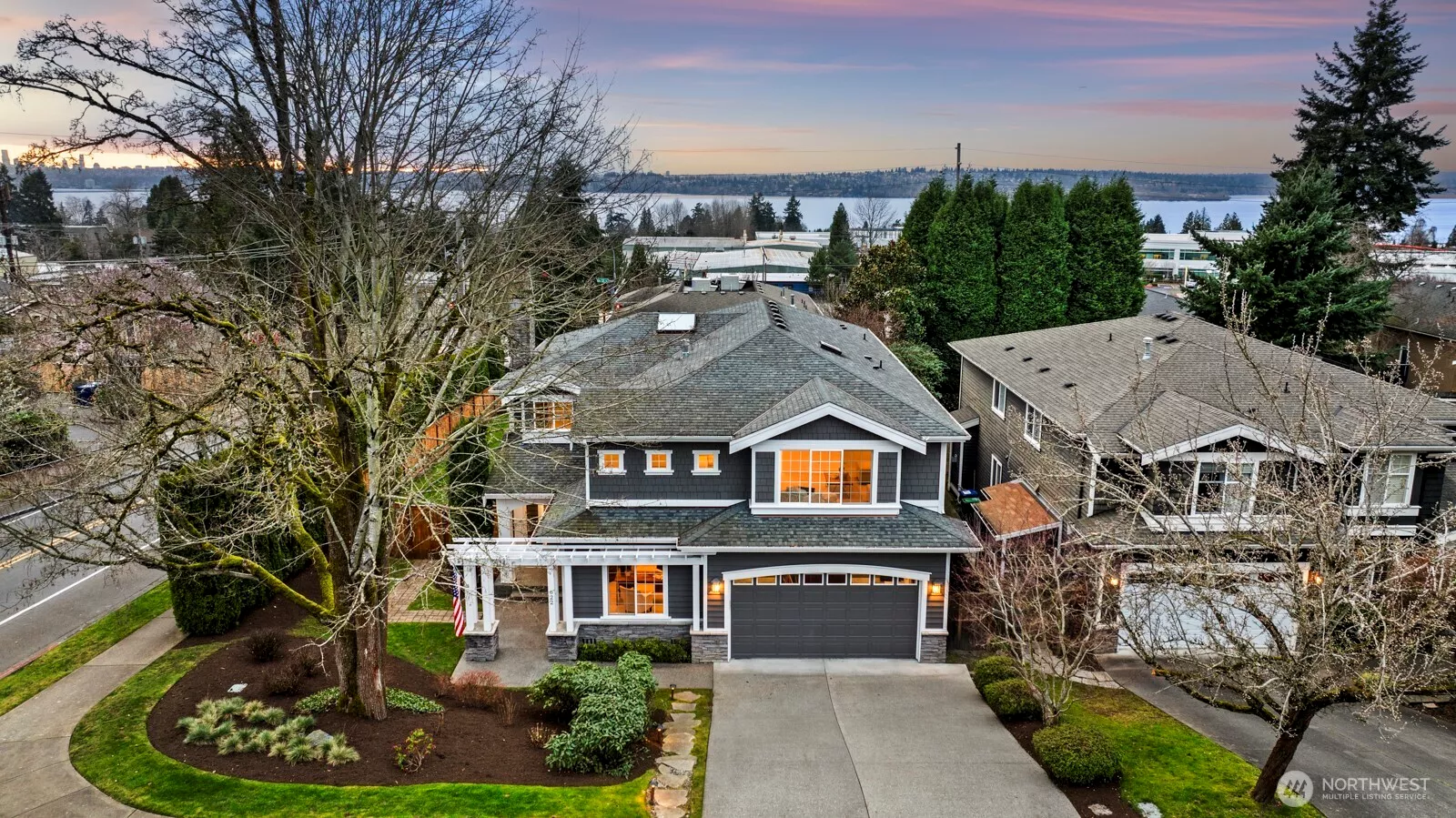 Commanding attention from a southern corner lot on a tree-lined street in coveted Kirkland, this craftsman is the dream home you've been searching for!