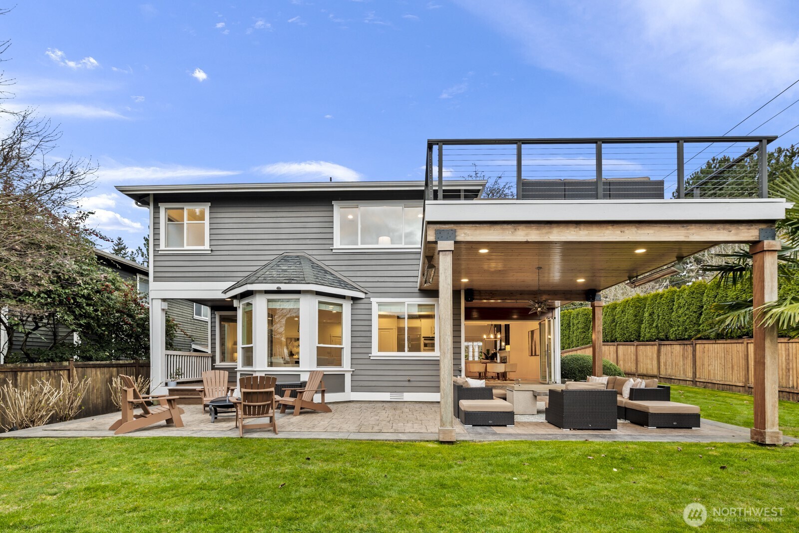 The covered patio is equipped with heaters, a fire pit and a TV (all included in the sale) and flows easily onto the sun-drenched portion of the patio for year-round enjoyment rain or shine.