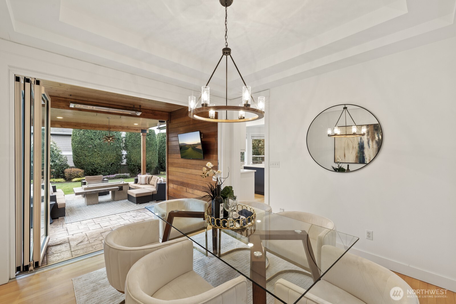 A custom Nanawall opens wide to expand the living spaces out onto the one-of-a-kind covered patio.