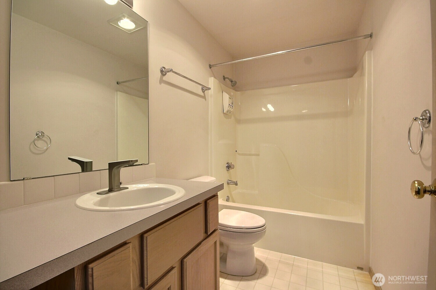 Upper level hall/guest bath has been hardly used.  It features a tub/shower and lots of counter space.