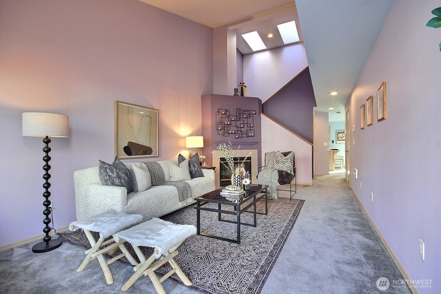 Soaring vaulted ceilings and natural light flank the generously sized living room.