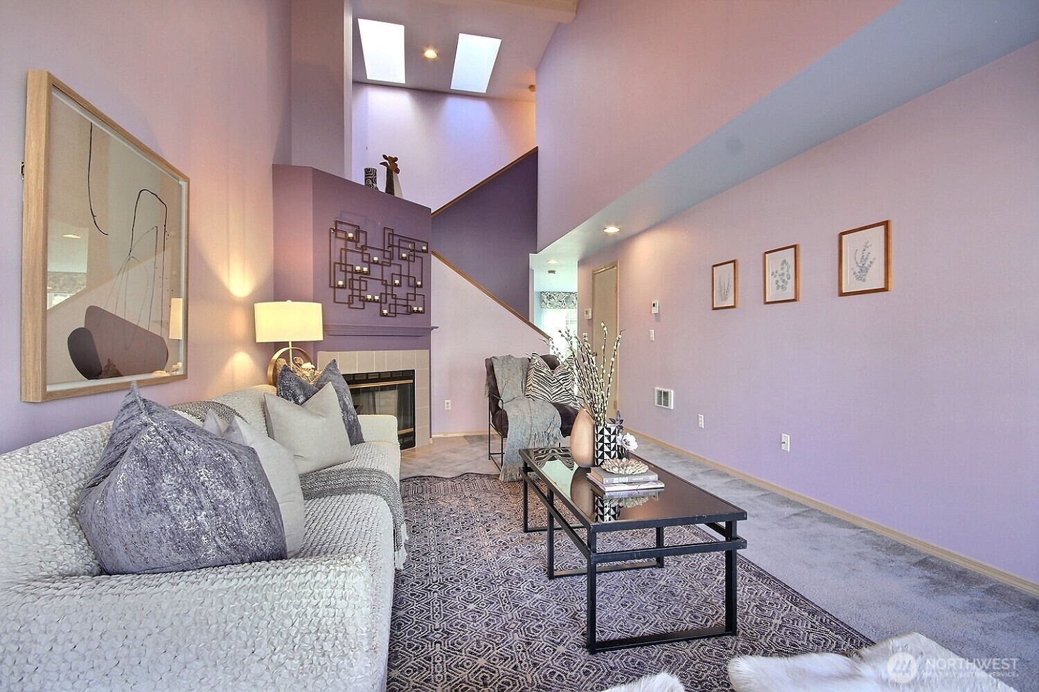 This large living space offers a versatile layout for your largest sectionals and statement furniture, all framed by elegant high-sloped ceilings.