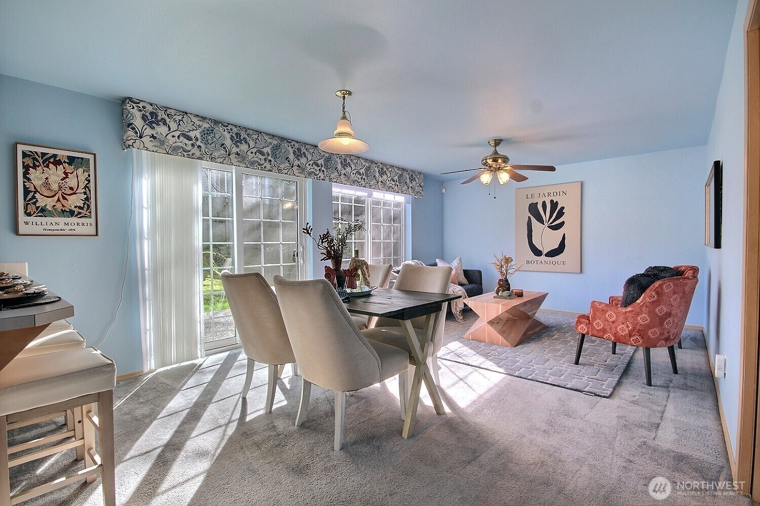The casual dining area and family room flow seamlessly together, offering peaceful views of your private patio and the green space beyond.