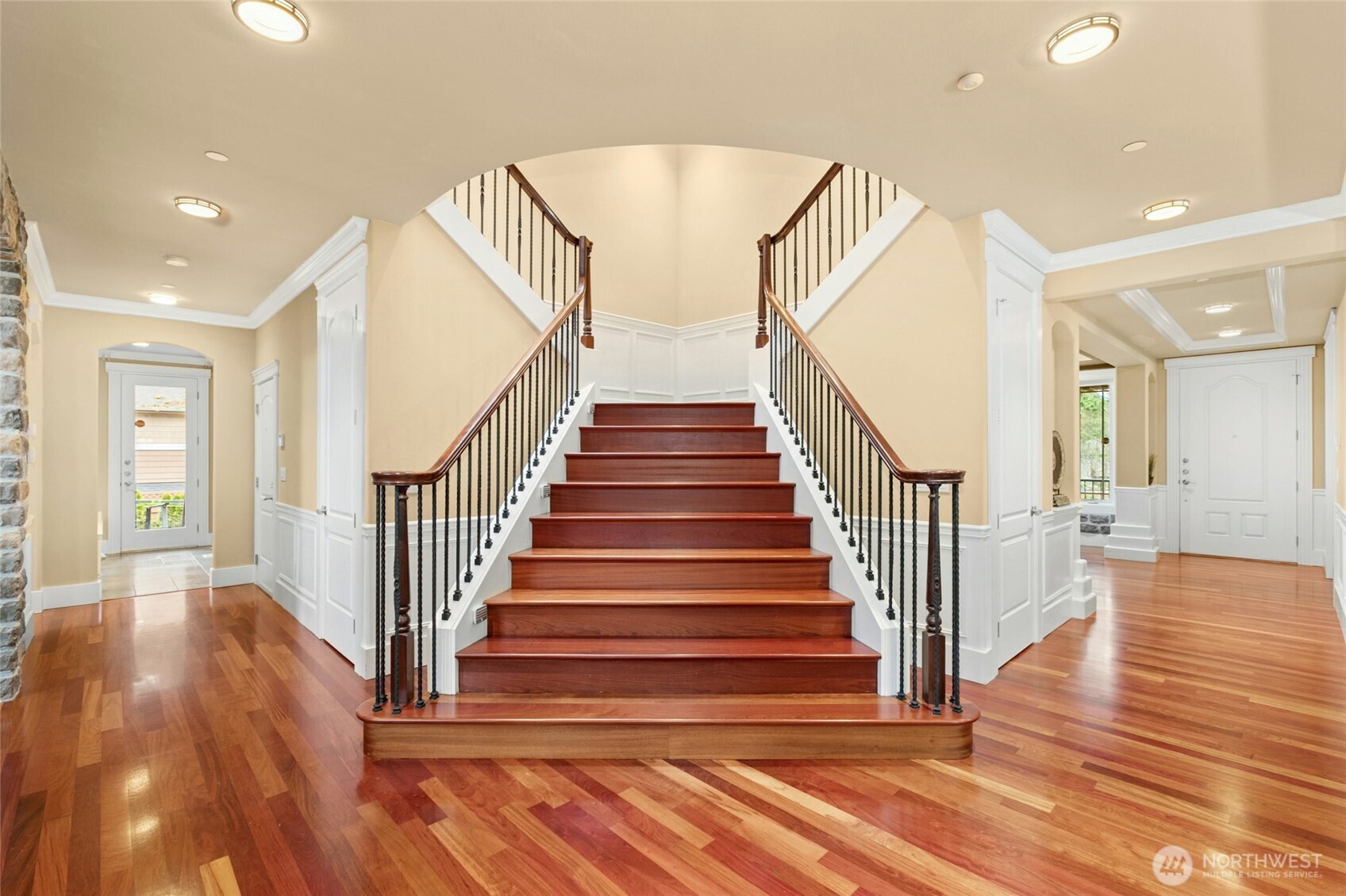 Striking Brazilian hardwood staircase, a true statement of quality construction and pride of ownership.