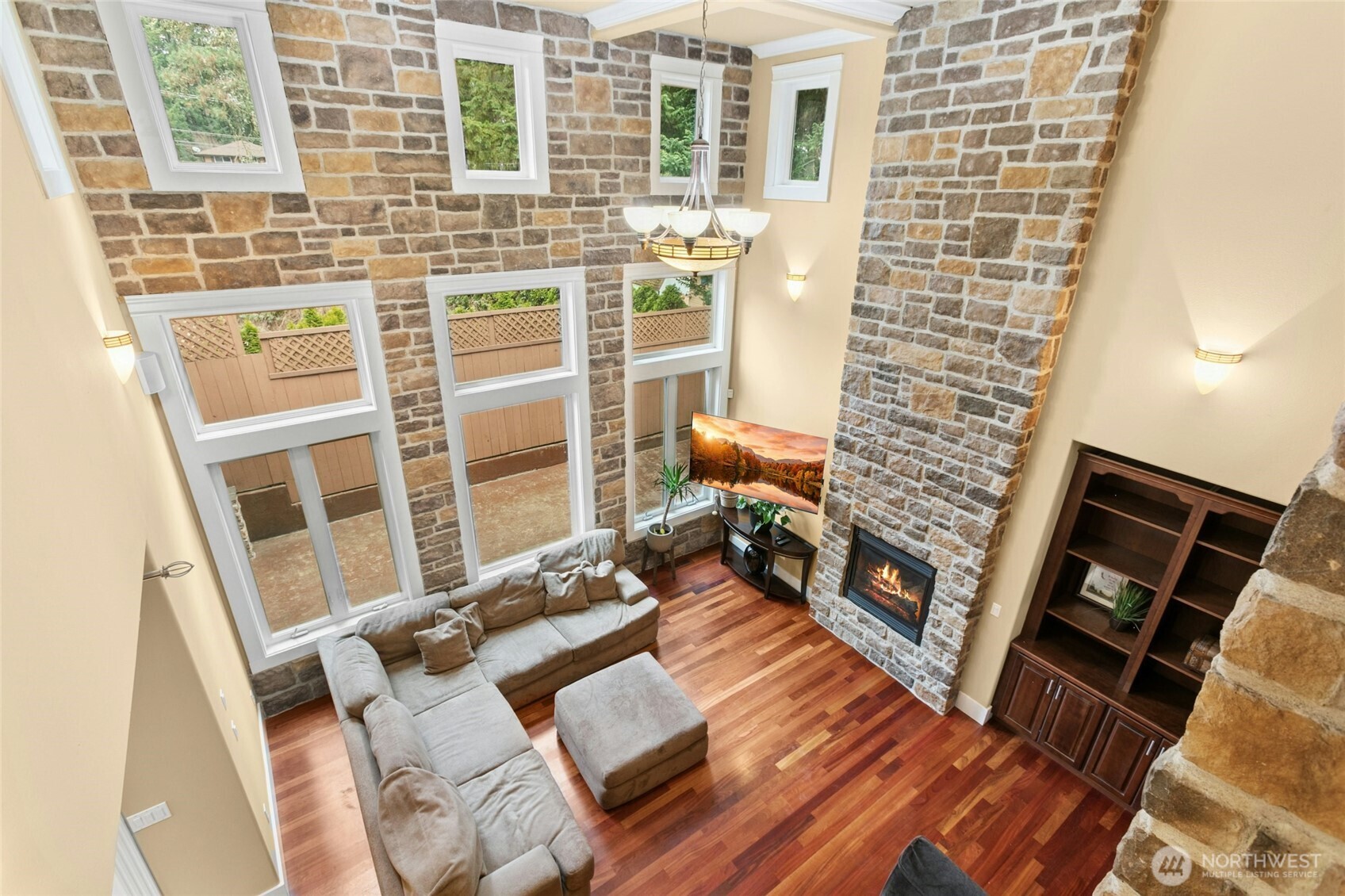 Grand living room with an open second-floor overlook, creating a stunning sense of space and light.
