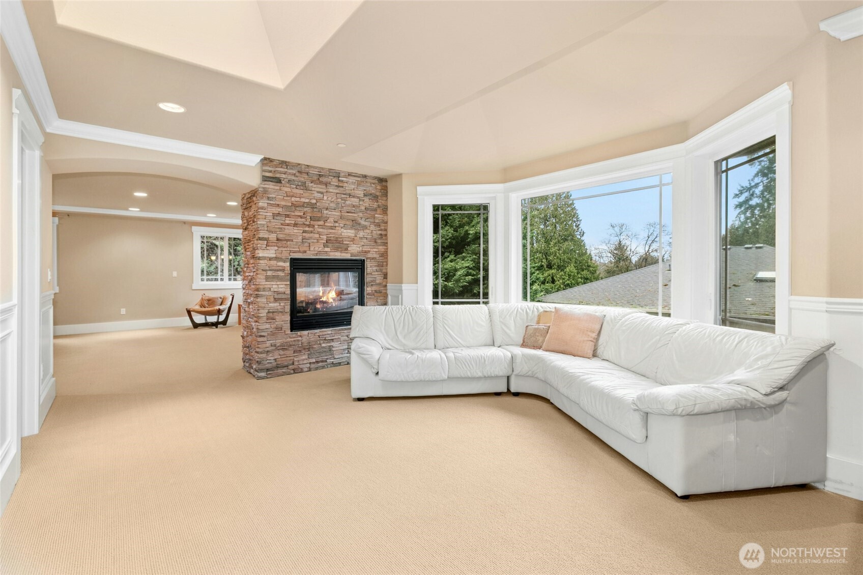Elegant bonus sitting area with fireplace, seamlessly connected to the primary suite—perfect for a private retreat.