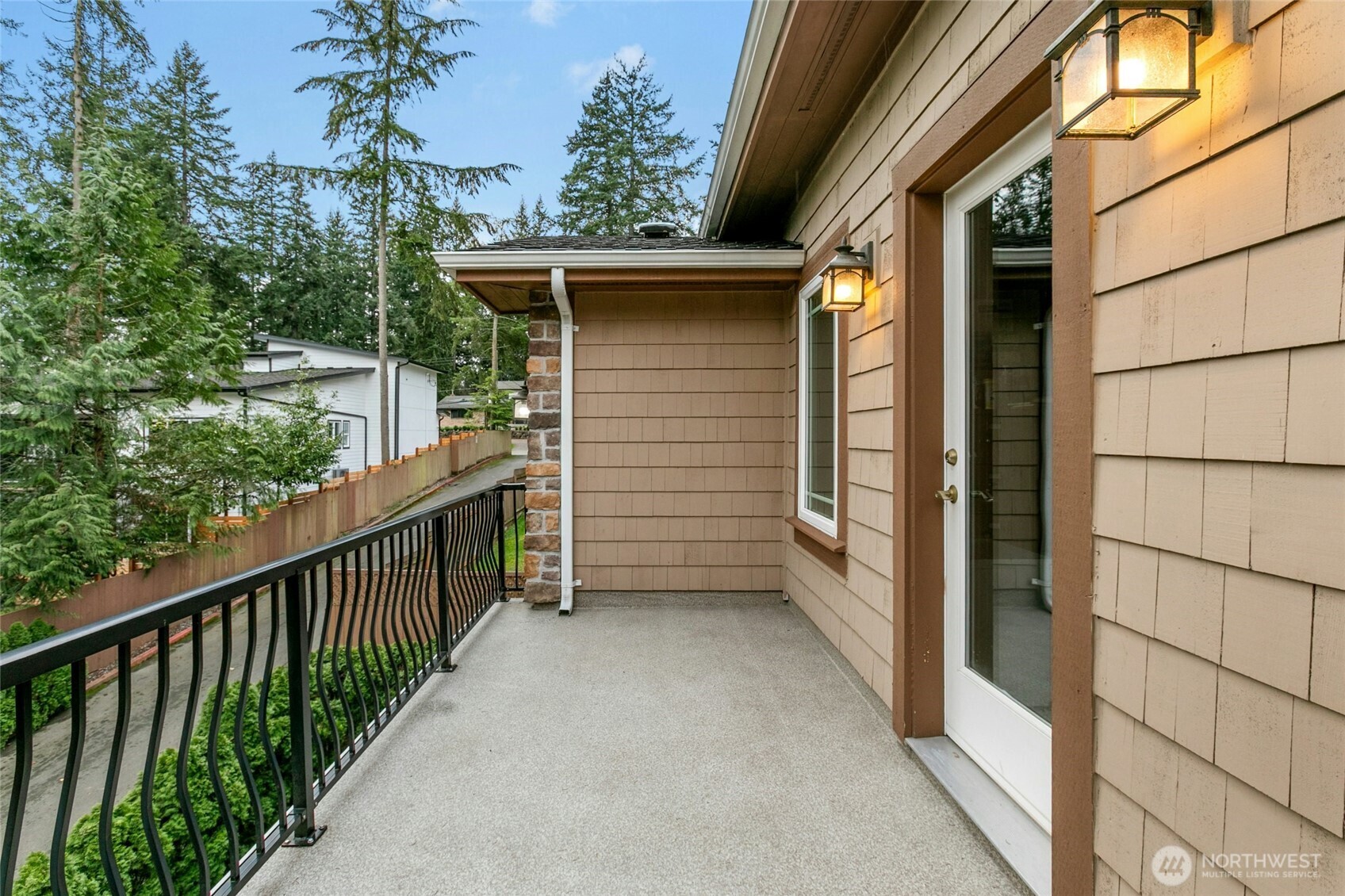 Elegant Romeo and Juliet balcony with direct access from a secondary bedroom, currently utilized as a private office.