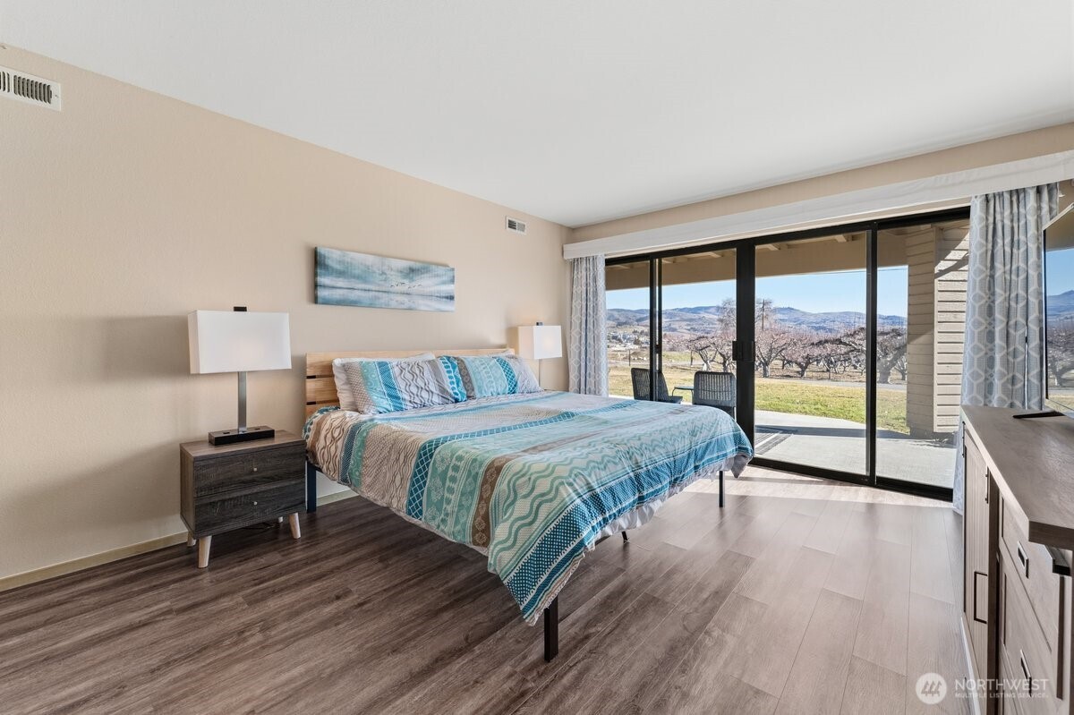 Lower Level Bedroom w/access to patio & lawn