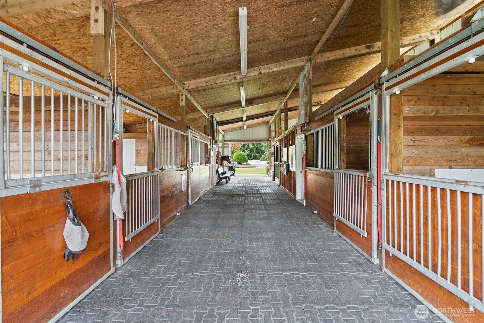 This thoughtfully designed space combines practicality with premium materials for a superior equestrian experience.
