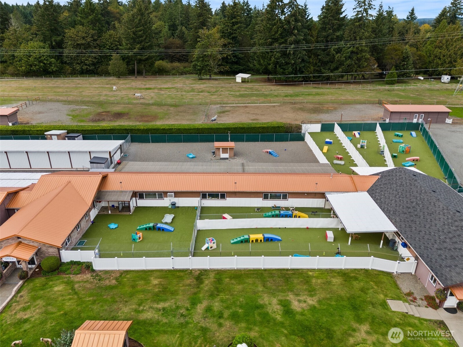 Outdoor dog play yards with k9 grass Astroturf, as well as sand play yards.