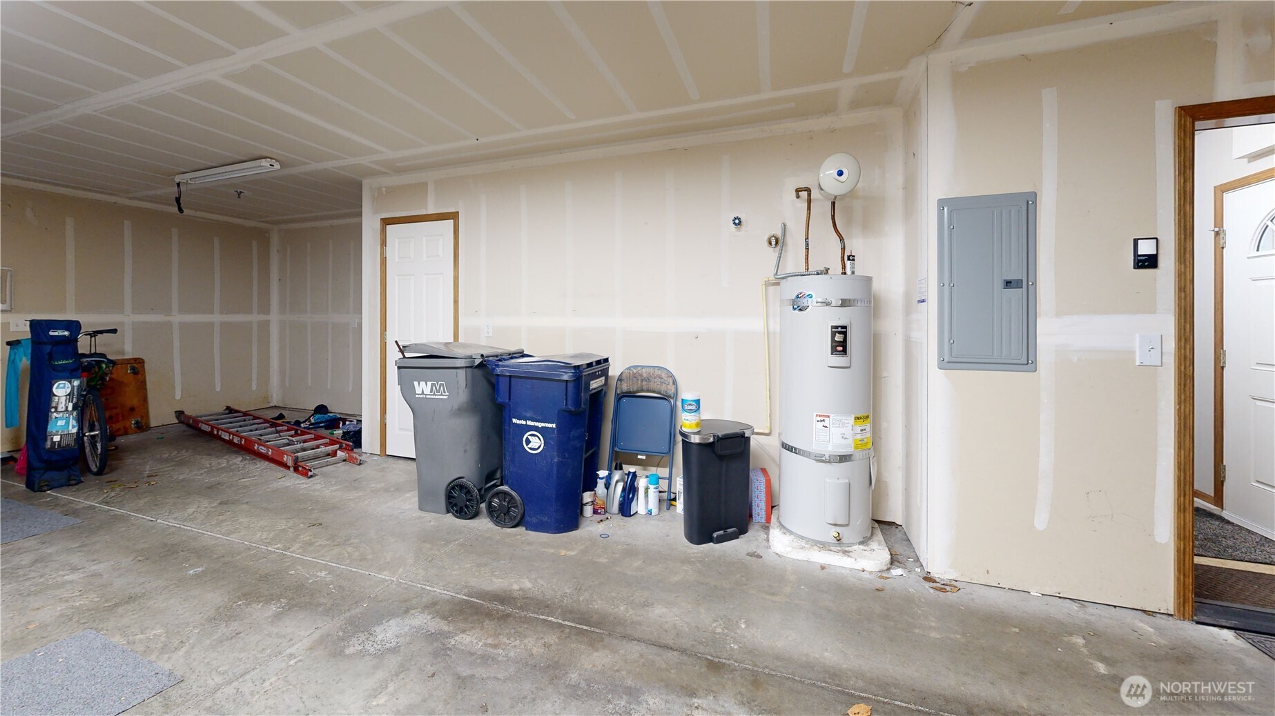 Extra room to the side of cars plus a storage room by the garbage cans.