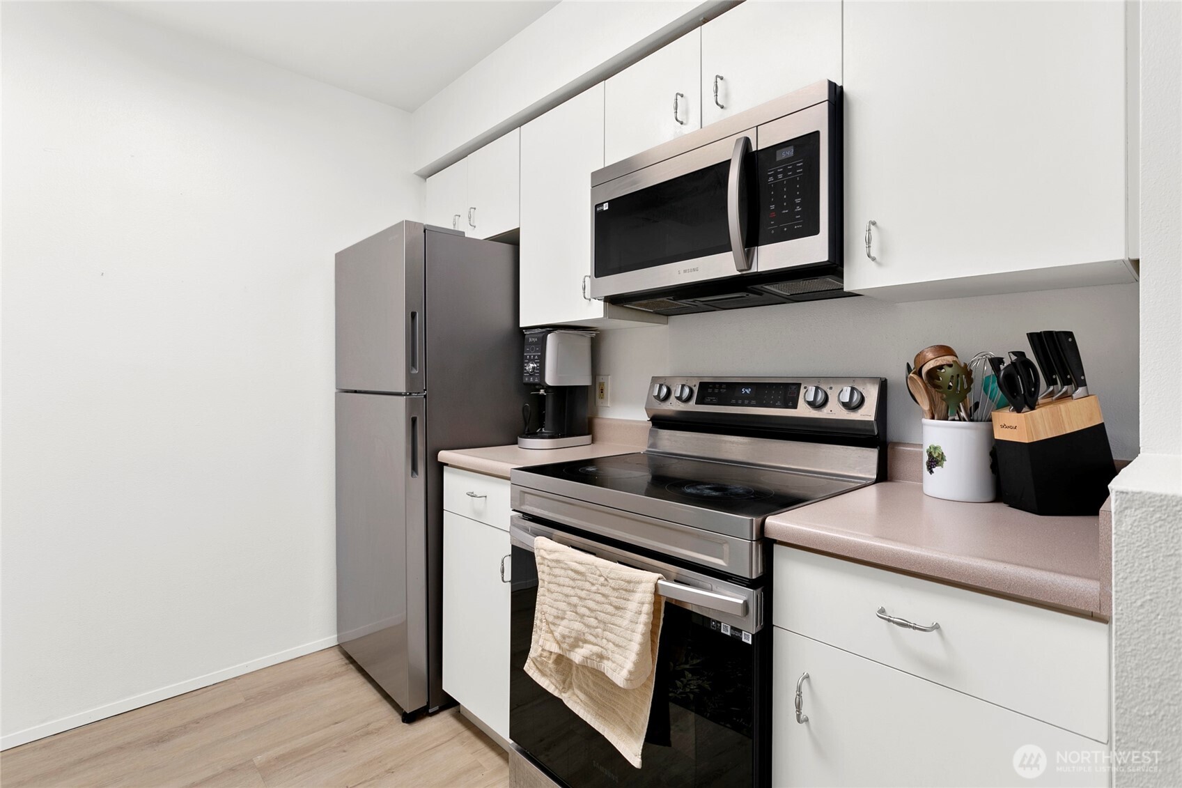 Stainless appliances and nice updated flooring. Lots of storage space.