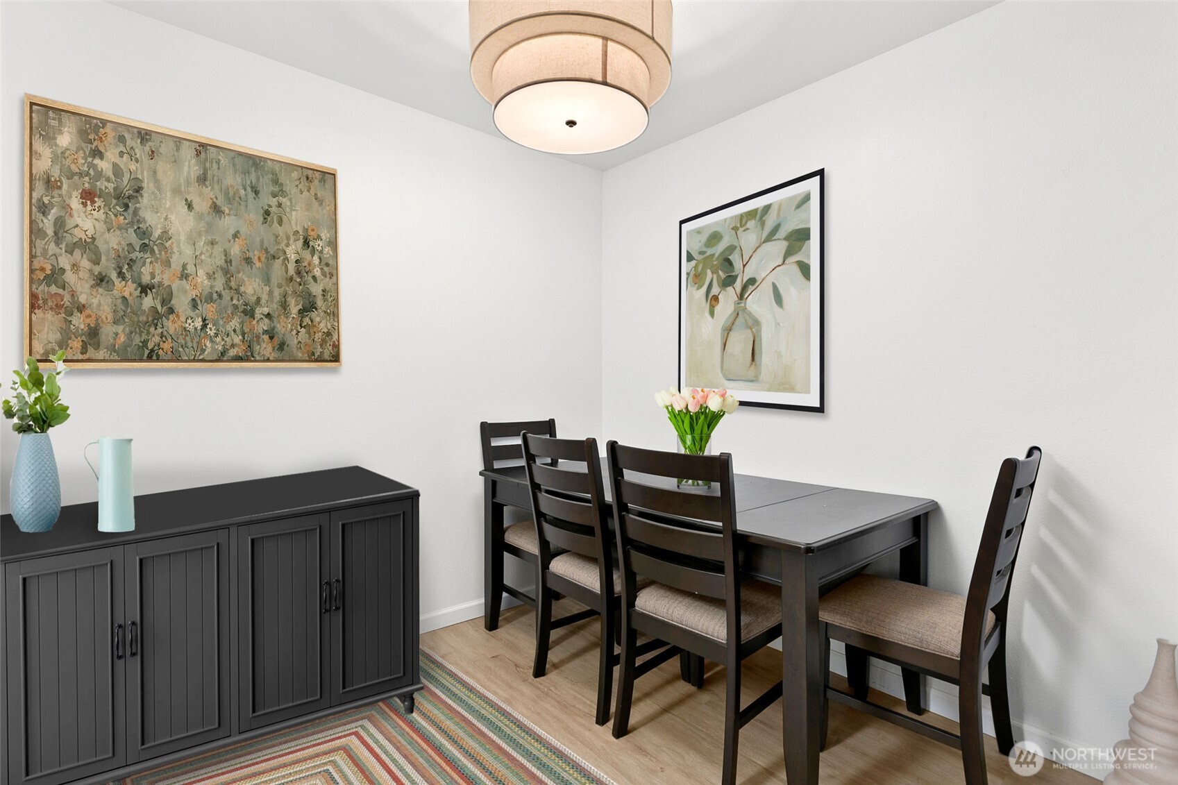 The dining area is nicely placed between the kitchen and living room.