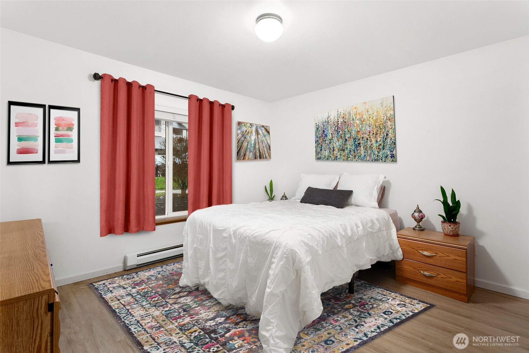 Good sized bedroom with big windows and updated flooring.
