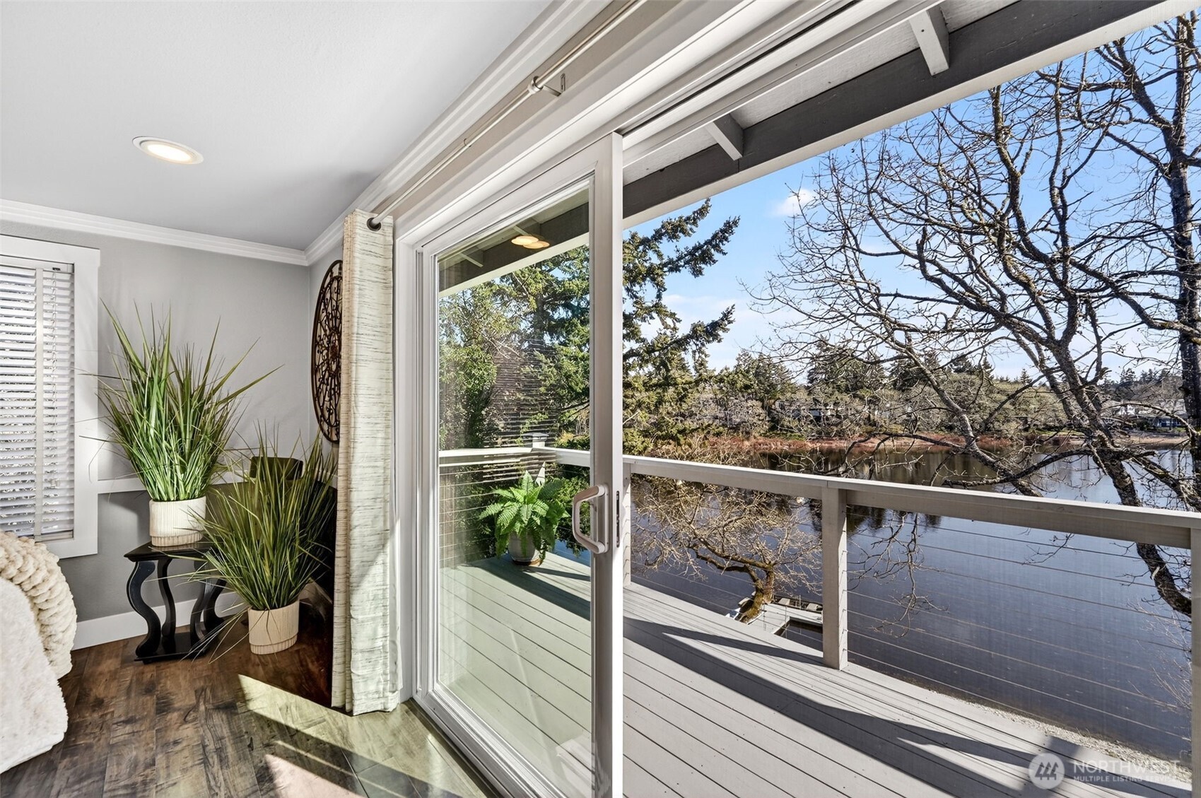 Open the doors and step out to sweeping water views and fresh lake air.