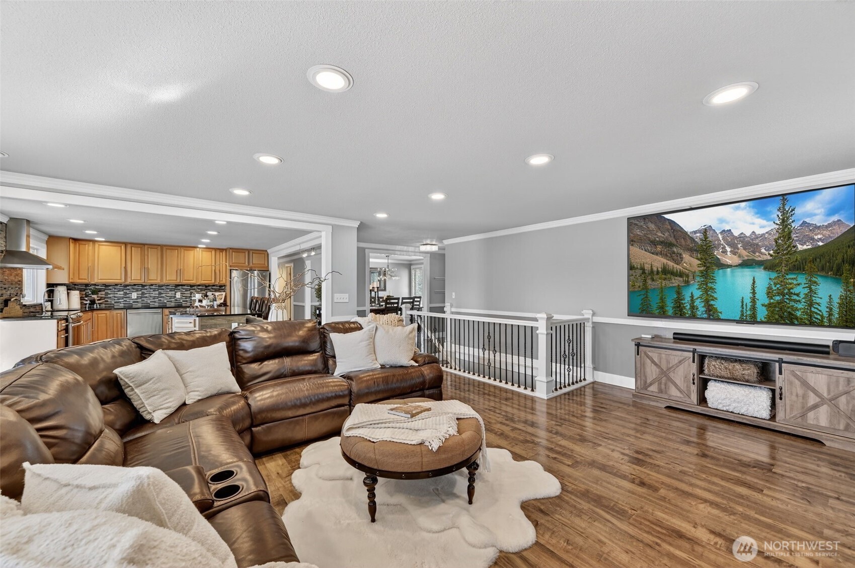 A striking fireplace anchors the space adding warmth and architectural interest.