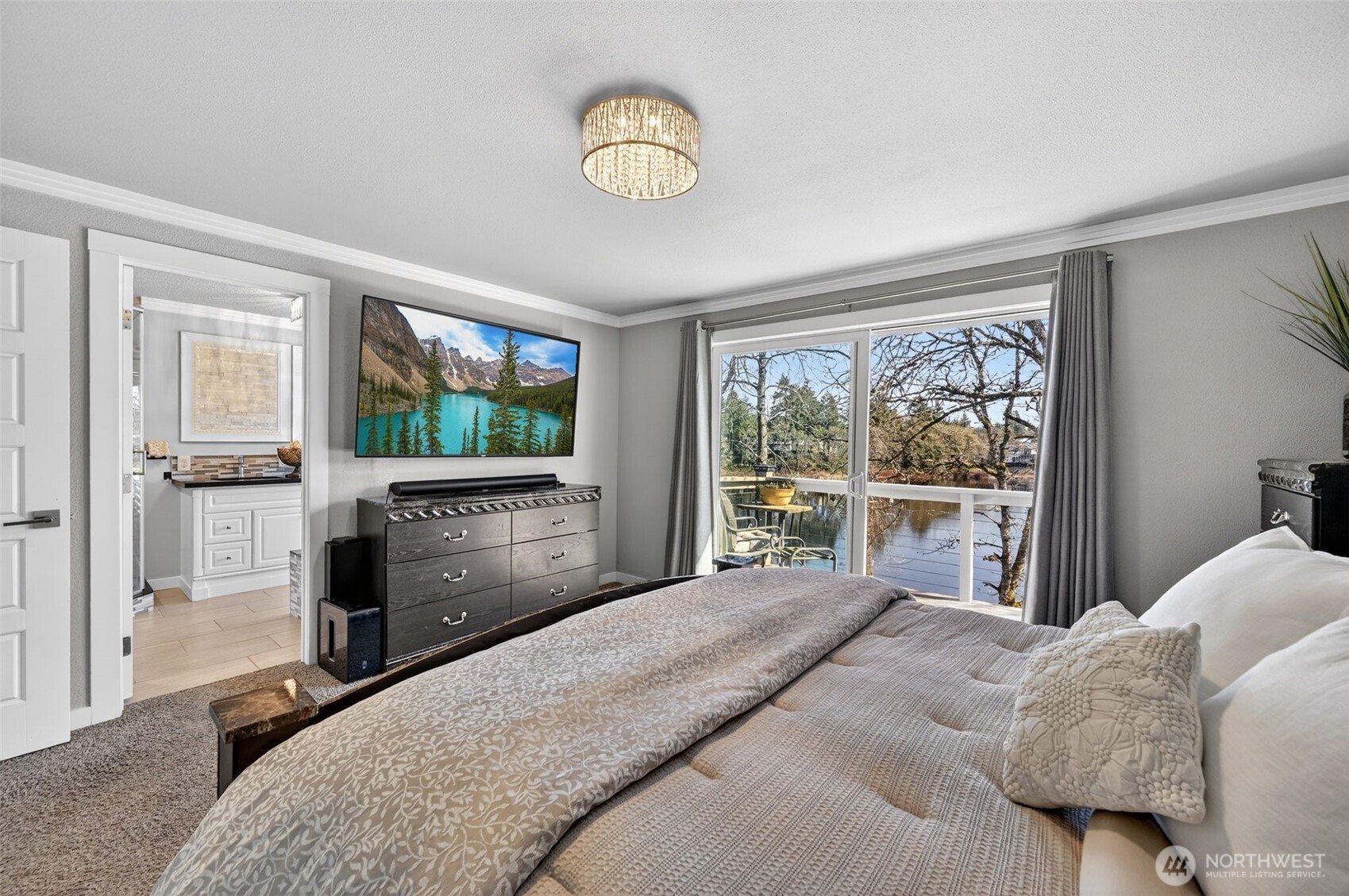 Showcase-ready custom garage with built-in cabinets, sleek slatwall, and striking hexagon LED ceiling lights.