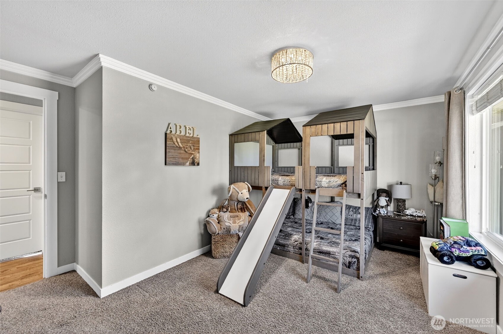 Spa-like Primary bathroom with double vanity, quartz counters, large soaking tub, sleek shower and lake view.