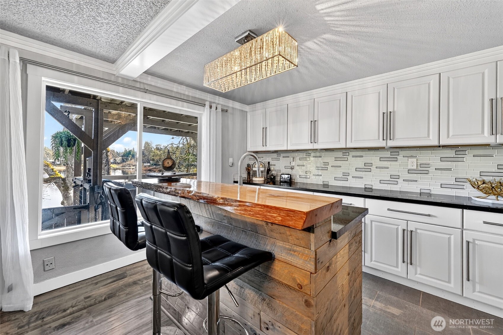 Kitchenette and bar area offer added convenience-ideal for entertaining or guest quarters.