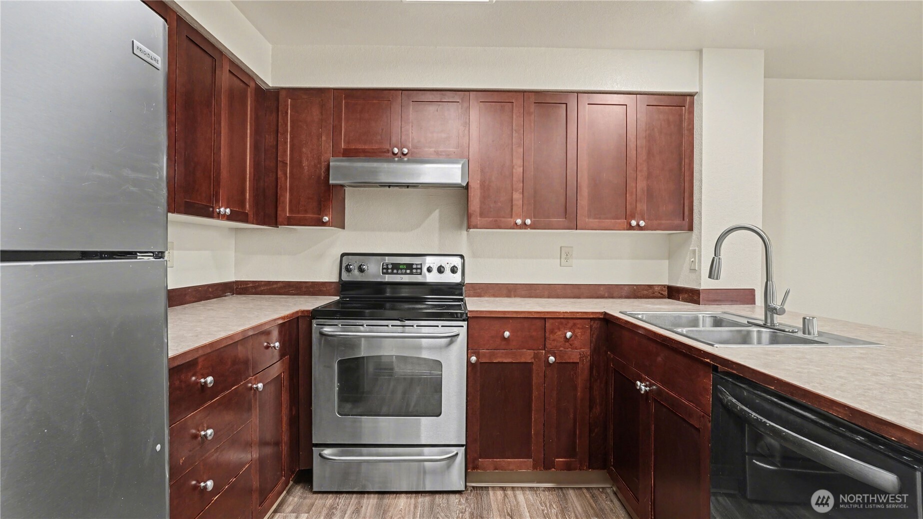 Rich cabinetry, sleek countertops, stylish sink & all appliances stay.