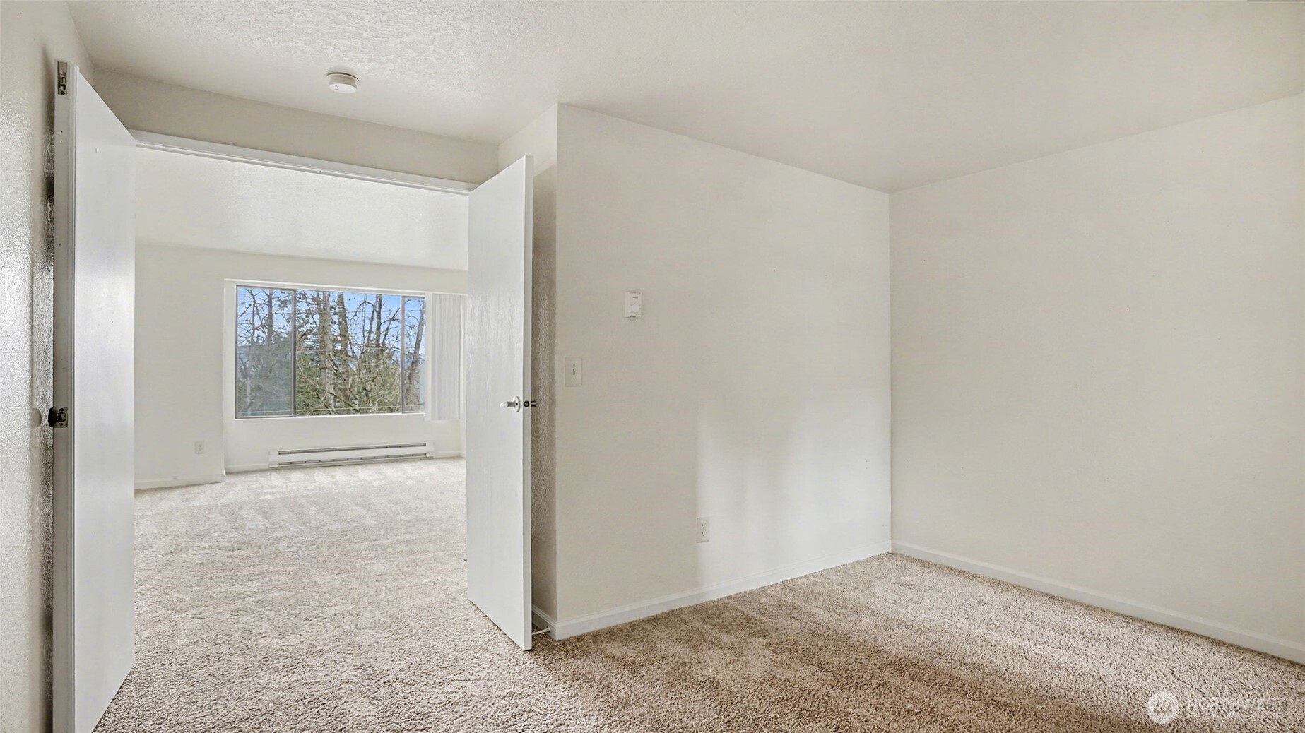 Just off the living room, French doors open to office/3rd bedroom.