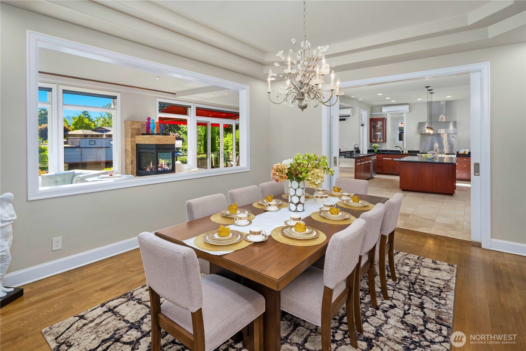 A beautiful look at the back of this majestic house. Direct from your dock through the canal to Lake Washington. House comes with the Yacht shown.