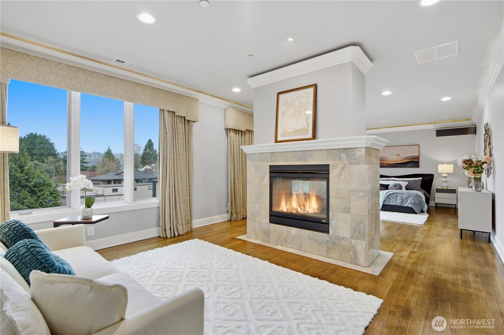 Primary retreat sitting area with fireplace