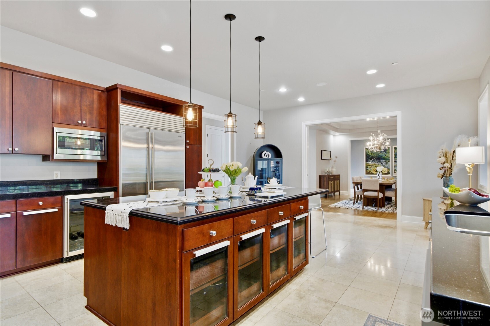 The Kitchen is the heart of the home and open to the formal dining room, informal dining room, living room, and a door straight out to the deck