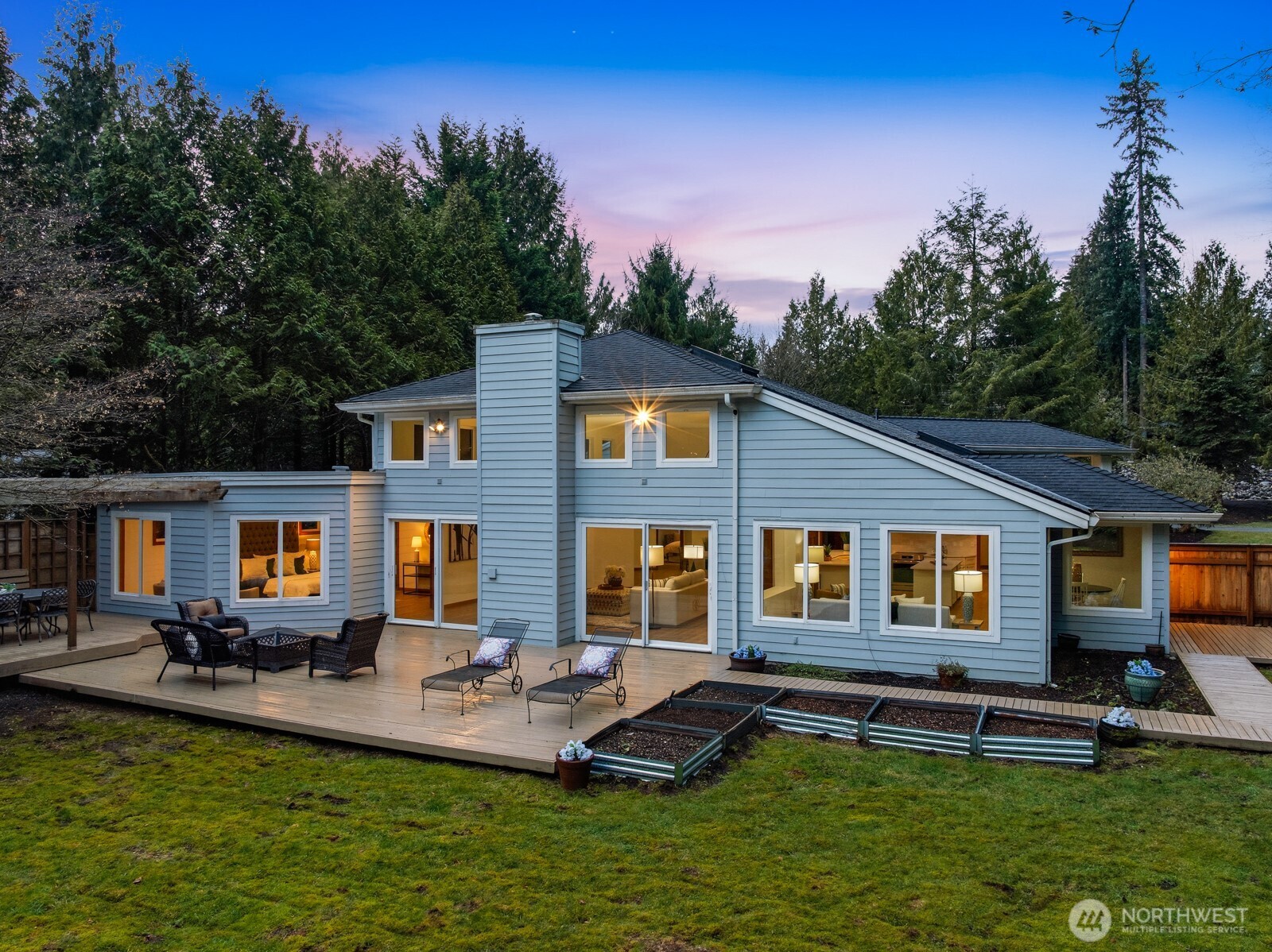 Light & bright with large windows and a fabulous wrap around deck and multiple entertainment areas!