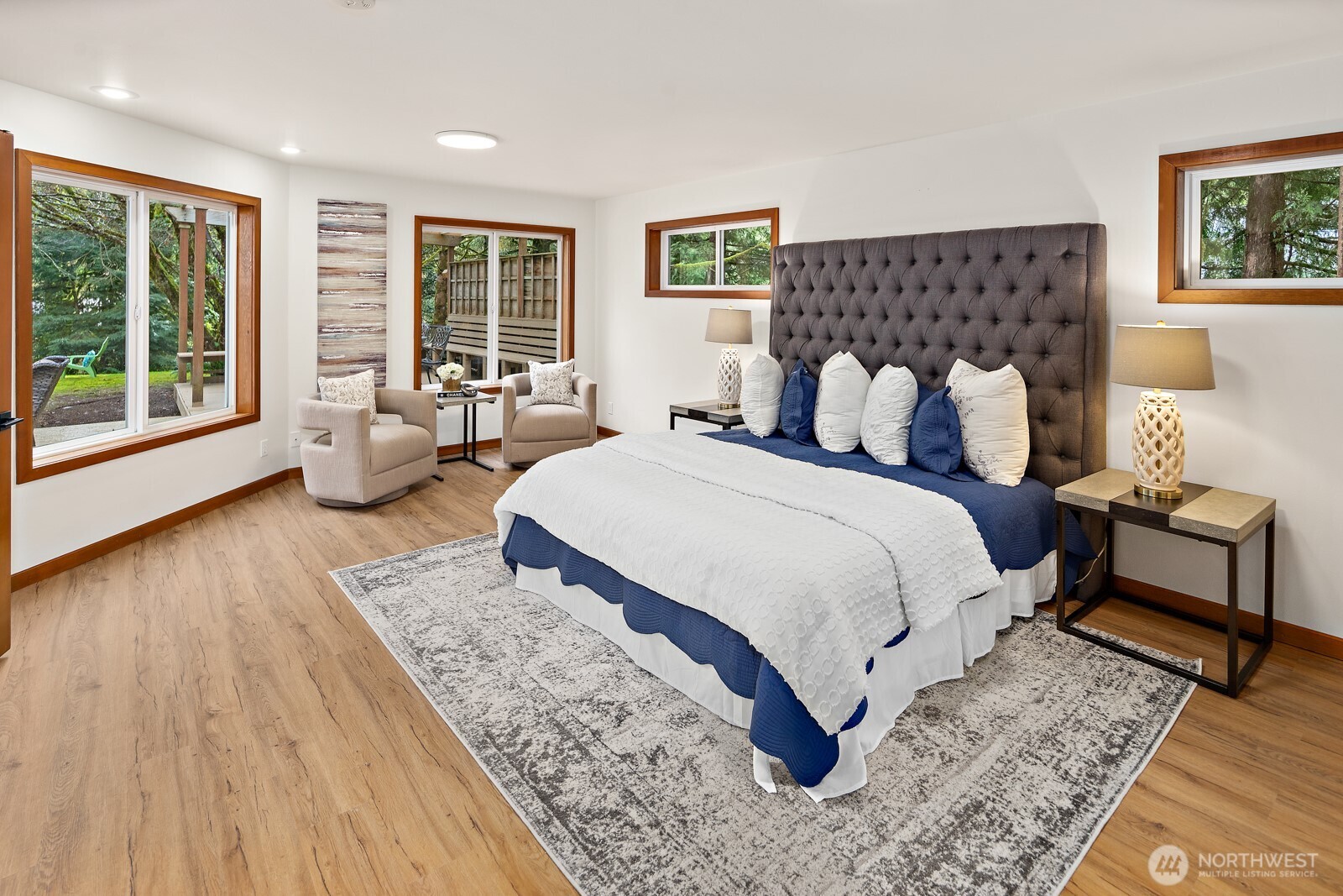 The primary suite is extra spacious with a wonderful sitting area overlooking the backyard.