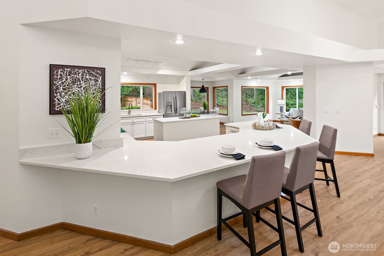 An oversized and exquisite island in the kitchen adds ease to entertaining.