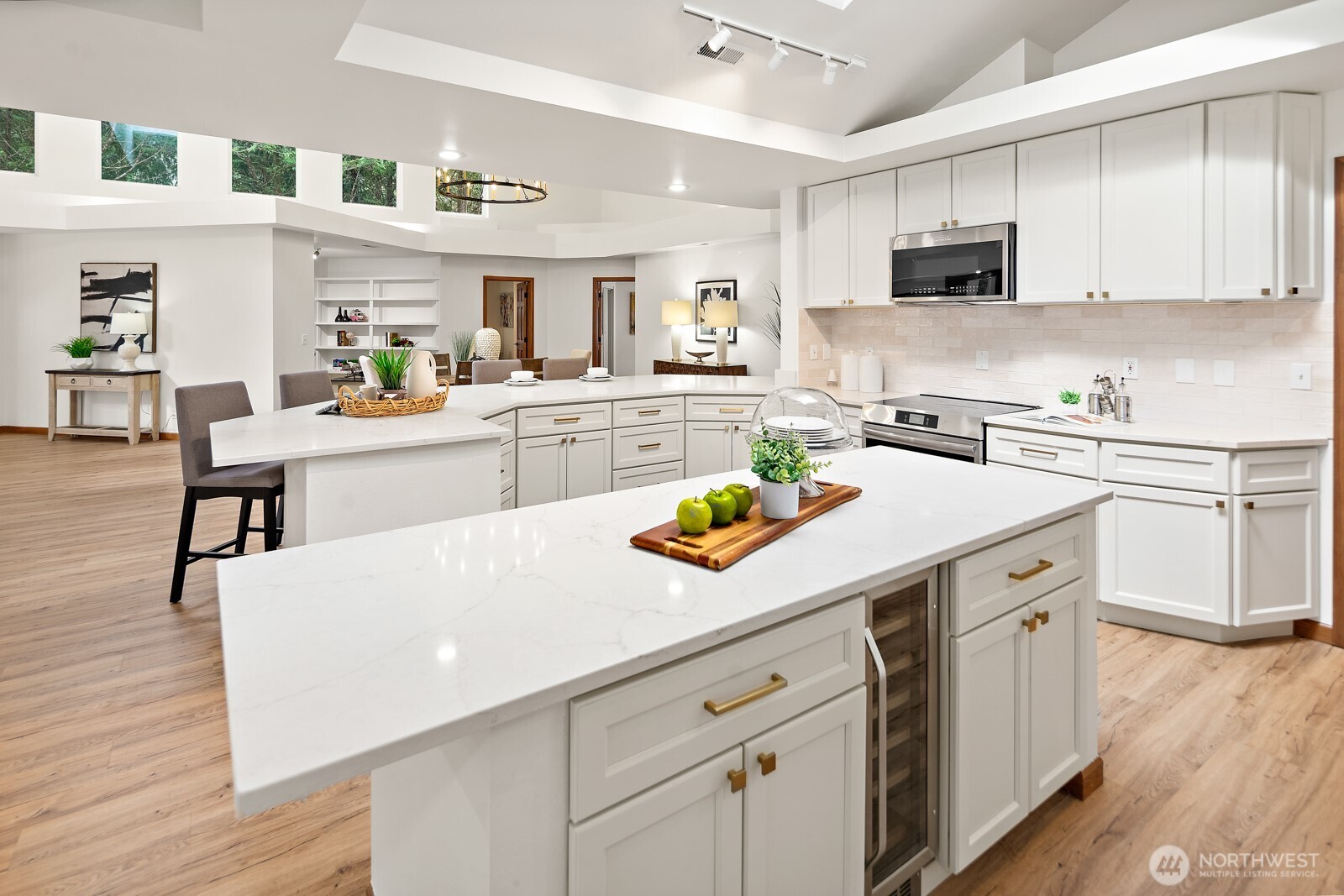Storage galore and plenty of prep space throughout the large light kitchen!
