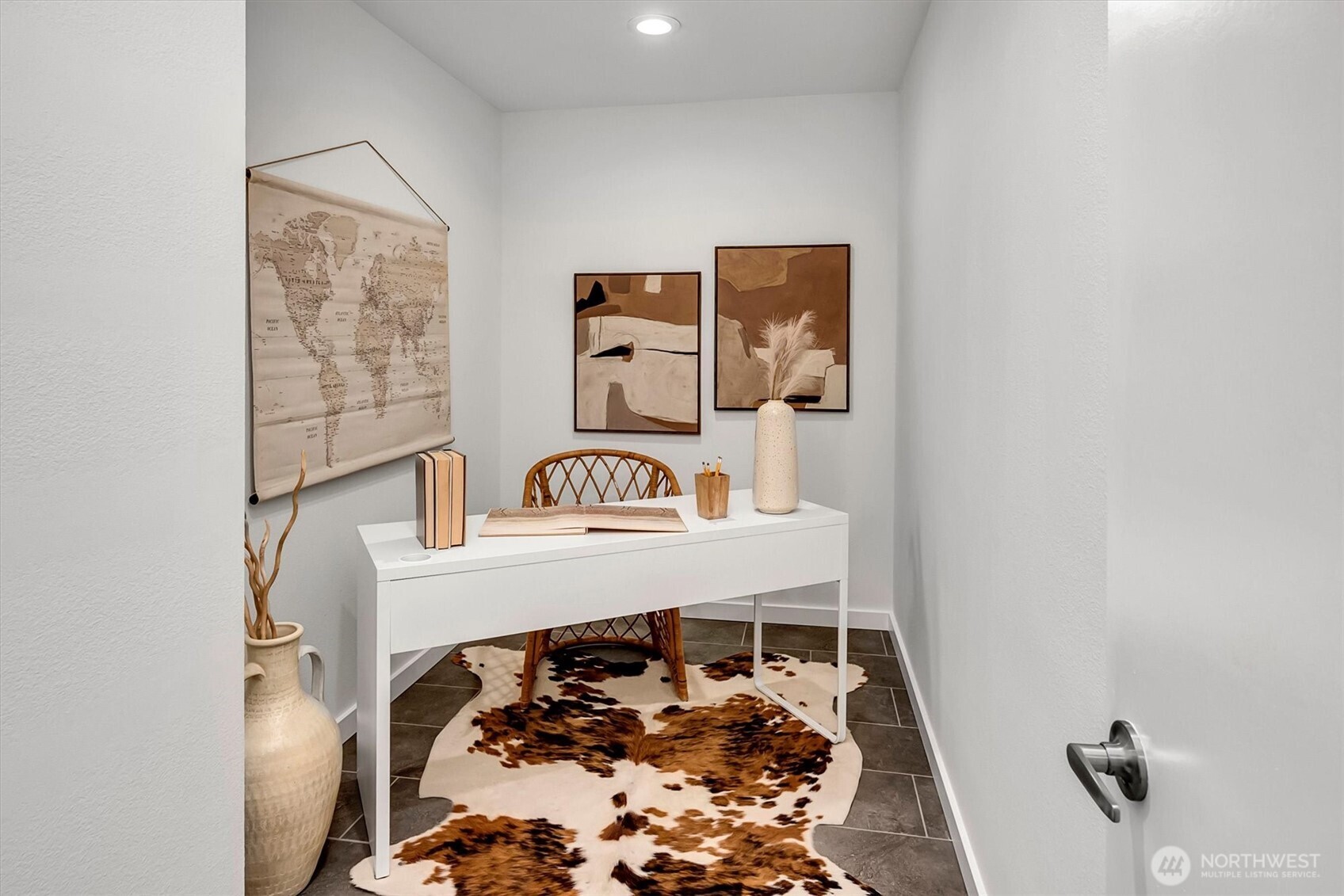 This fun room of the home was originally designed as a LARGE "storage" room. Now the perfect studio/den....sharing a wall with the living room, it could easily be opened up, pony wall perhaps....to create a really special "flex" space w/views of those Cascade mountains too. So many GREAT options in this wonderful home....you choose!