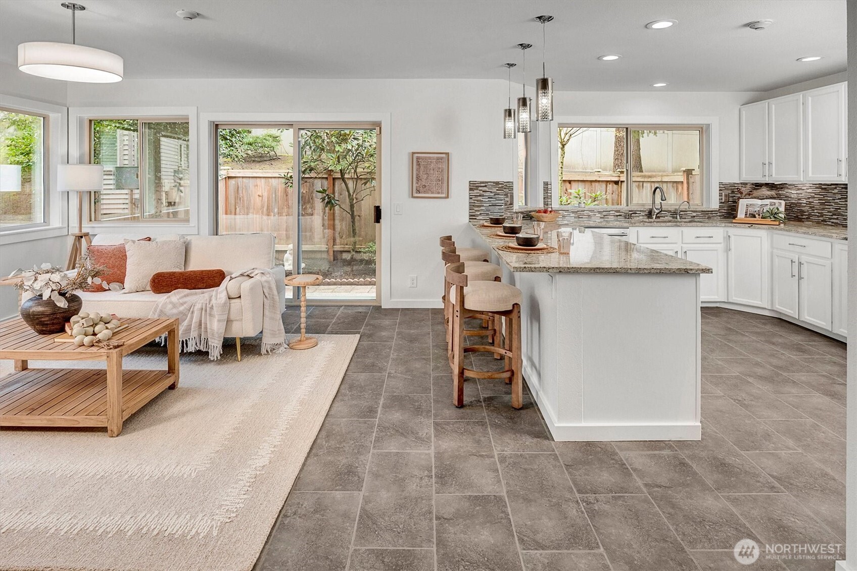 Updated beautifully....one room flows nicely into the next. Private patio w/nature surround....everything about this home is ideal.