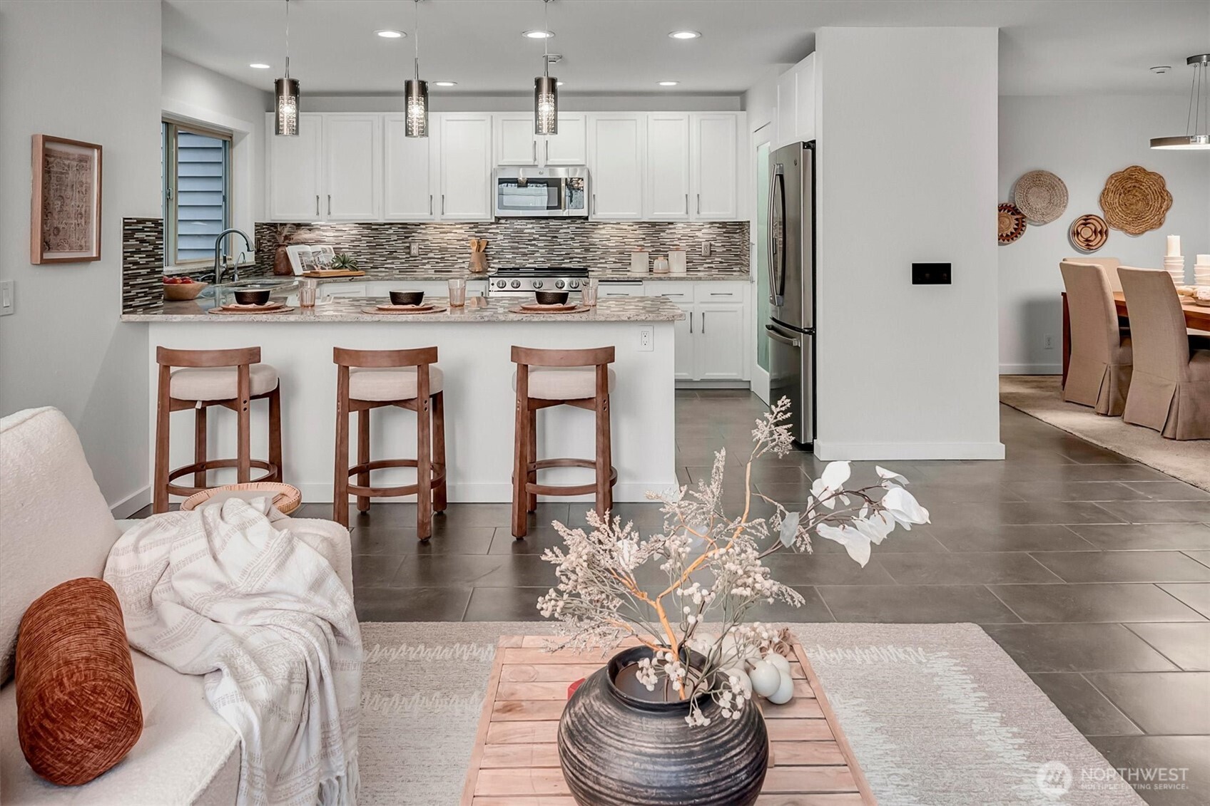 Nicely remodeled is every room w/custom lighting, custom tile flooring, all NEW interior paint, newer SS appliance package too. You are sure to notice + love the abundance of cabinets and storage in the home.    The floorplan is ideal for using rooms, re-imagining them the way you most love and choose to live.