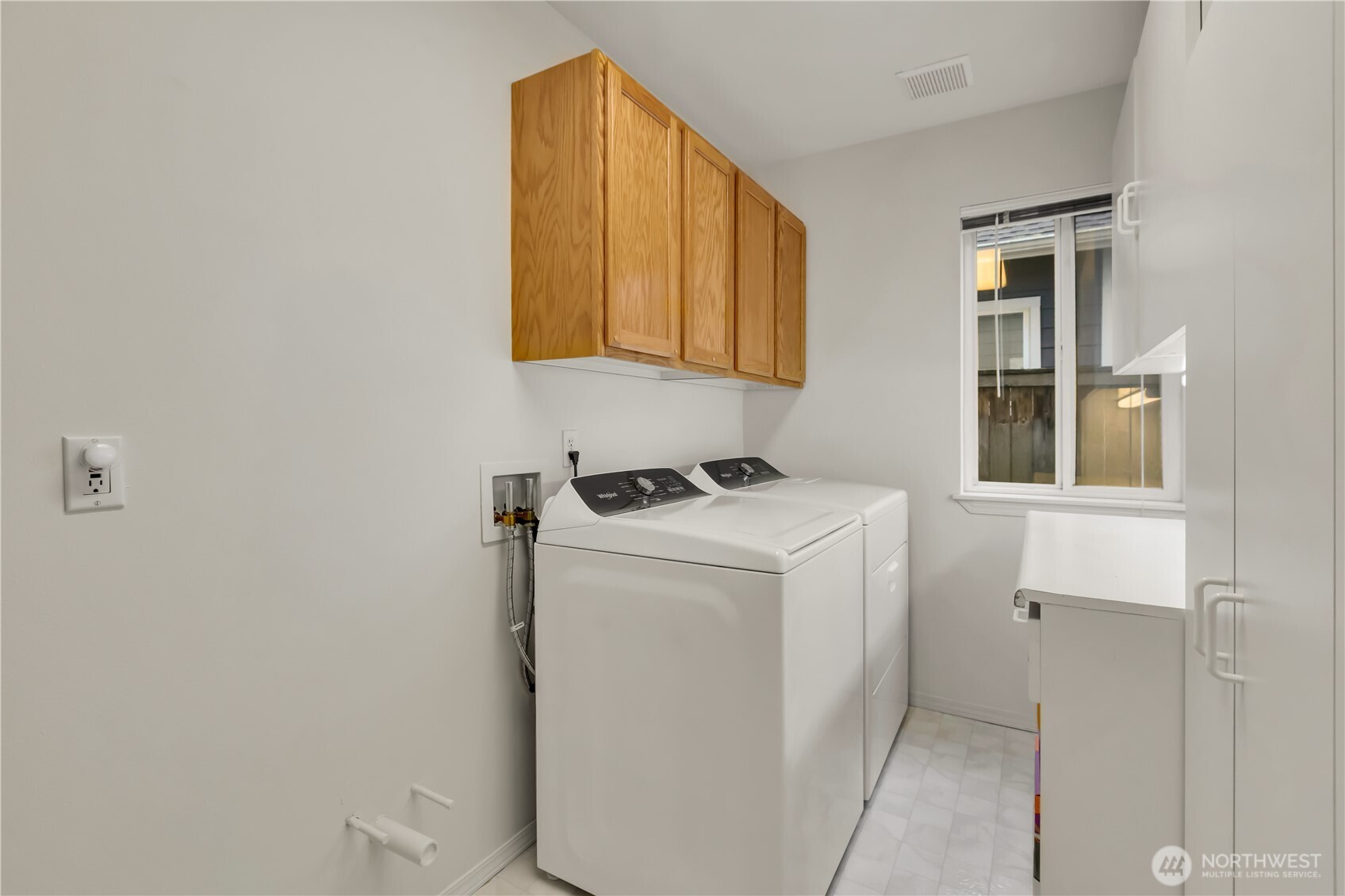 Laundry is located on the lower level and has ample room for storage.