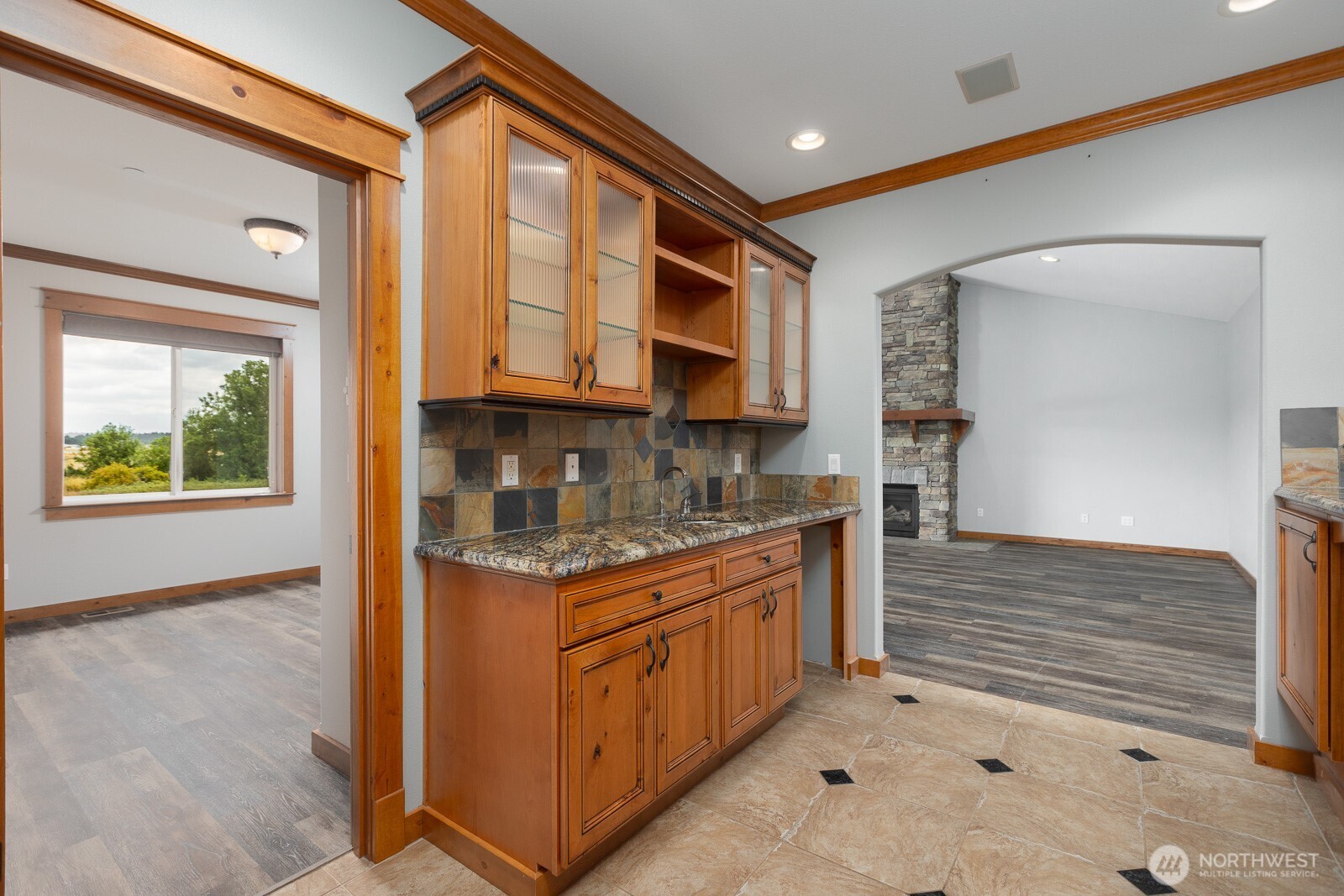 Wet Bar/Serving area leading to the 4th bedroom (on left) and bonus room (straight ahead)
