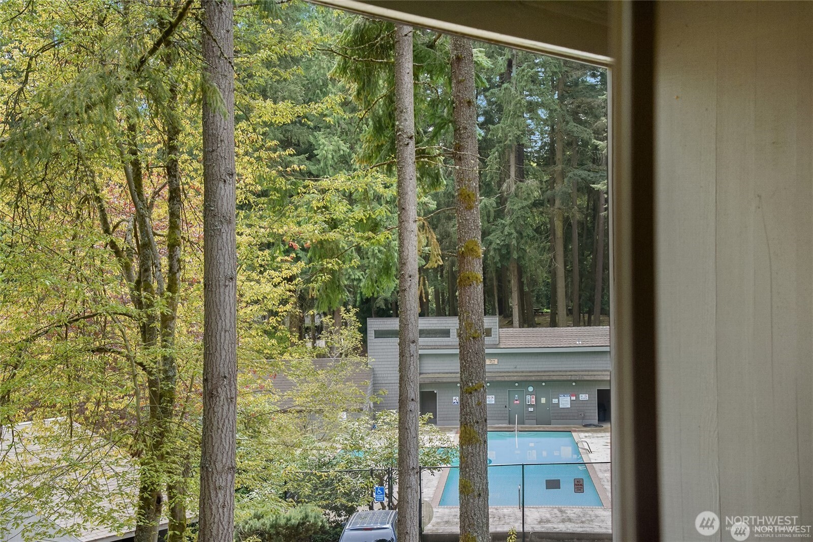 View from bedroom shows how close you are to the main pool, clubhouse, fitness center, and bar!