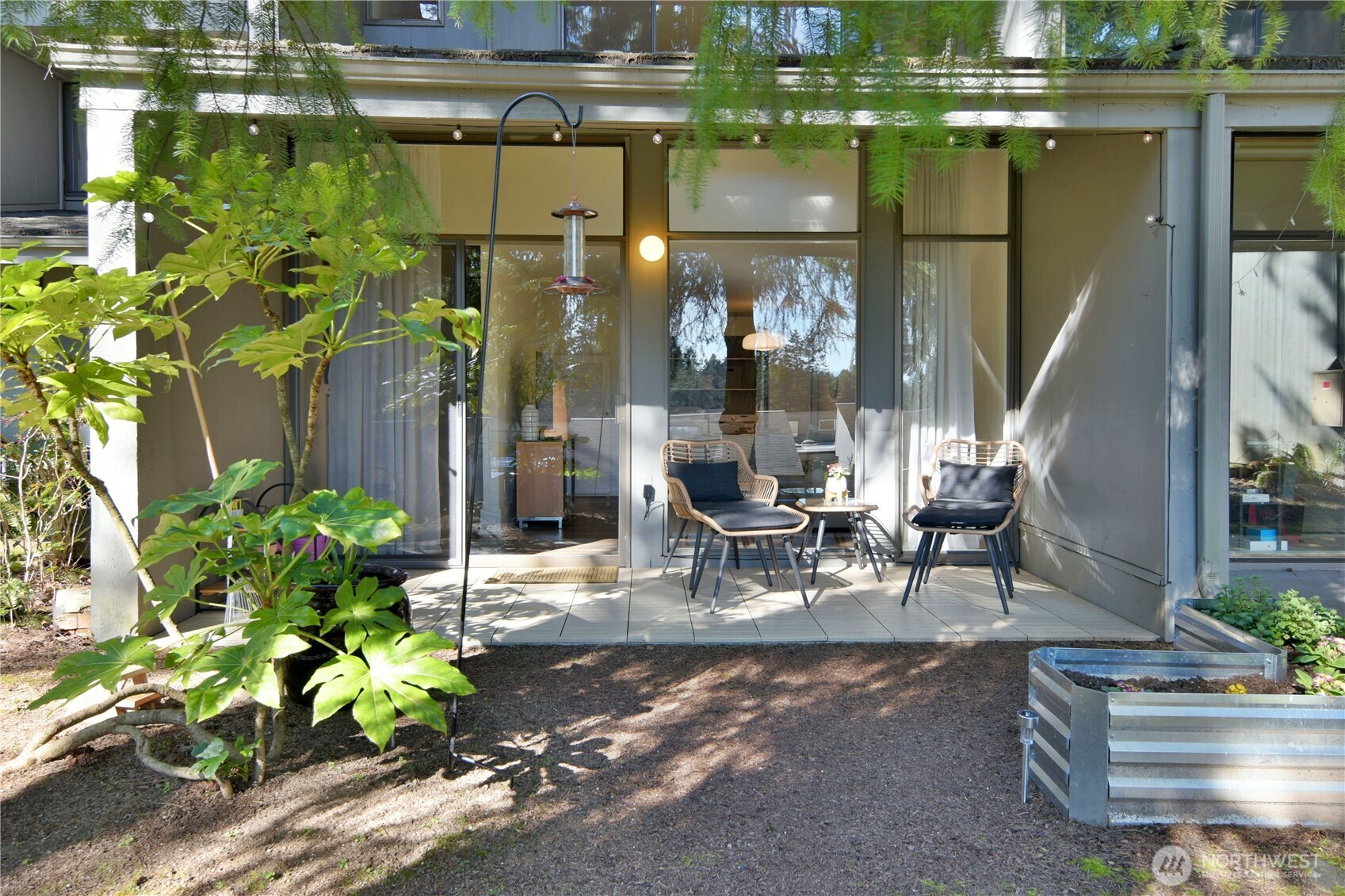 Peaceful back patio with garden bed