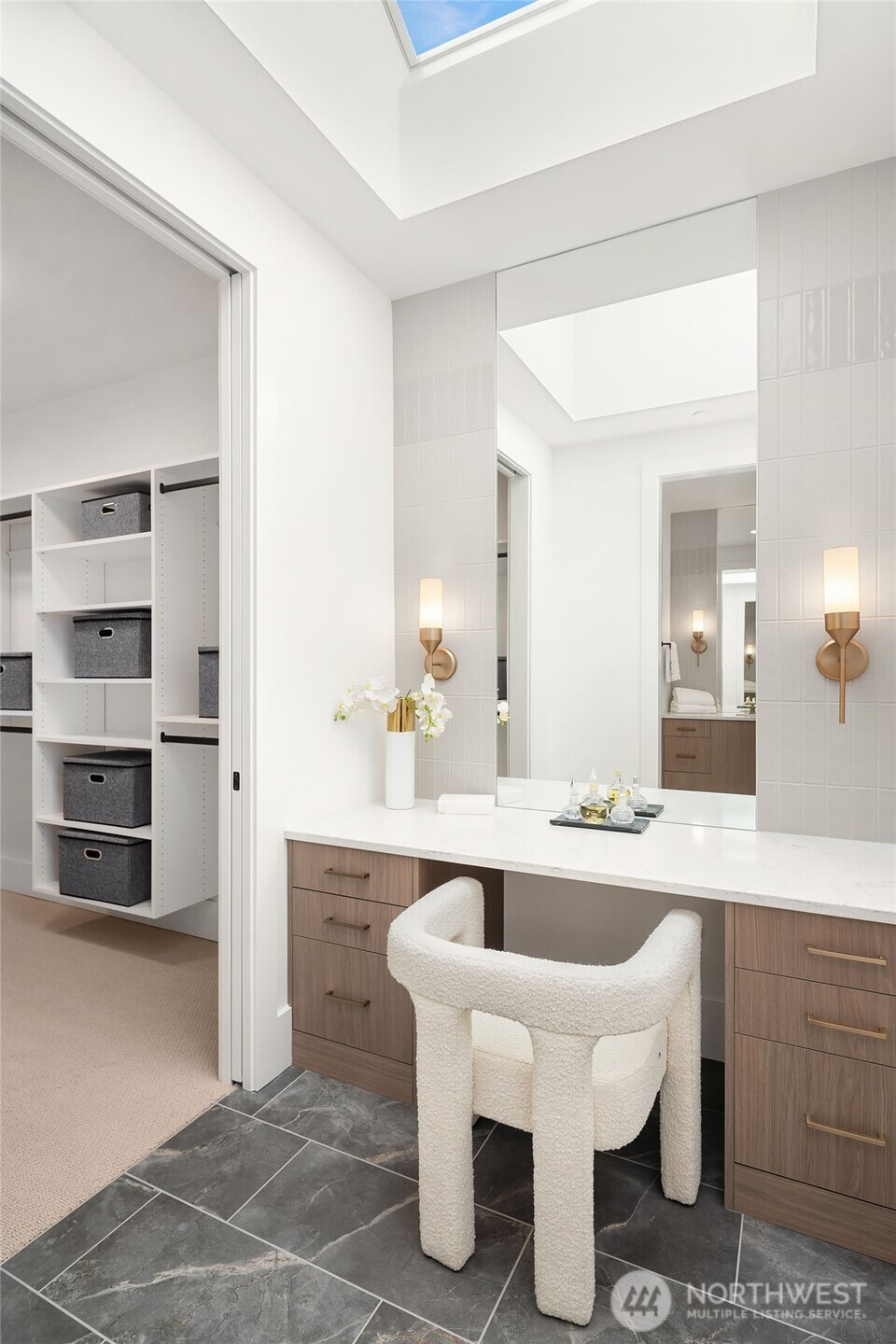Custom built-in illuminated vanity & 2 oversized walk in closets